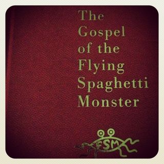The Gospel of The Flying Spaghetti Monster book cover, with the title in gold leaf serif lettering, on a red leather cover
