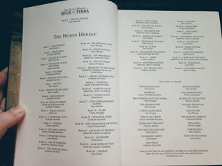 a double-page spread of all 54 previous novels in the Horus Heresy series, along with a list of 19 other books in the series