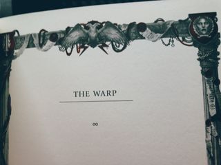 The chapter page for a chapter titled The Warp it features a stylised border of gothic and mechanical elements printed in greyscale and bold red