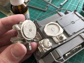 Work in progress shot of the metal parts glued to the plastic hull. The turret assembly is shown with magnets added