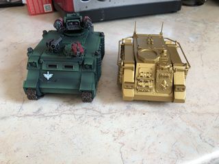 the assembled model next to a more modern Rhino-based model, showing a significant size disparity, with the older model being roughly 30% smaller