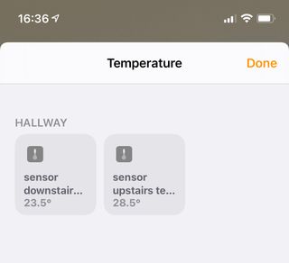two temperature readings: one is for downstairs and reads 23.5 degrees Celsius; the other is for upstairs, and reads 28.5 degrees Celsius