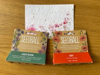 a pack of 'garden meadow' Seedballs, alongside a pack of 'poppy' Seedballs, and the back of the plantable thank you note.